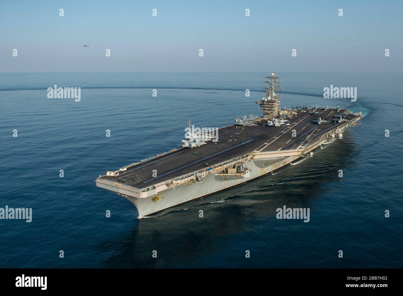 The U.S. Navy Nimitz-class aircraft carrier USS Dwight D. Eisenhower performs a routine transit March 18, 2020 in the Arabian Sea. Stock Photo