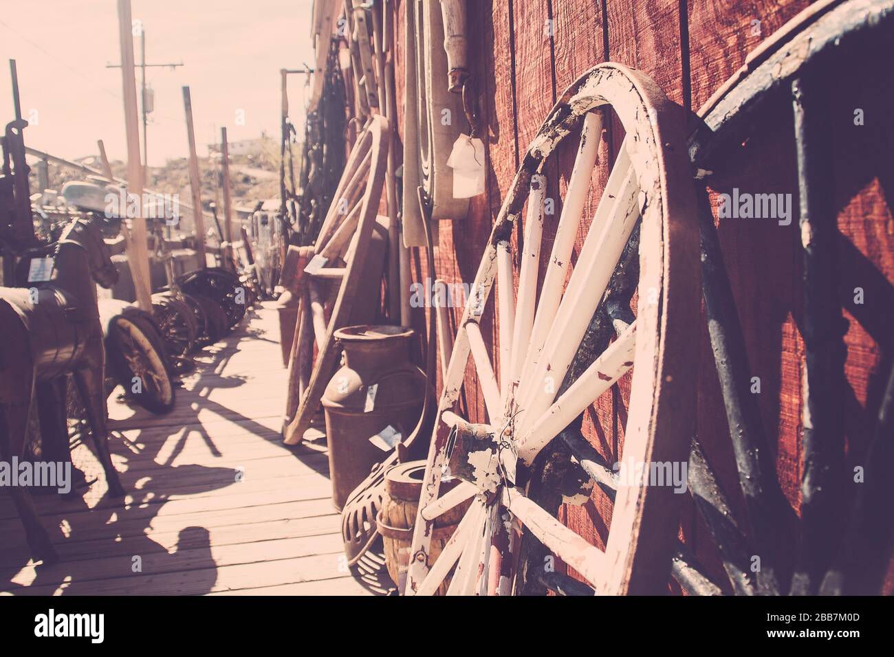 Wagon wheels, antiques, wooden building Stock Photo