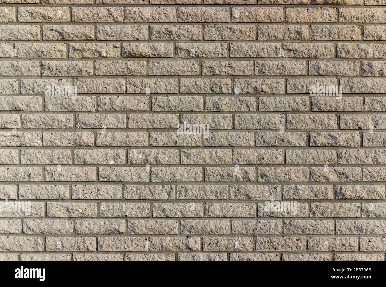 Wall and wall paneling with grouted bright clinker bricks Stock Photo