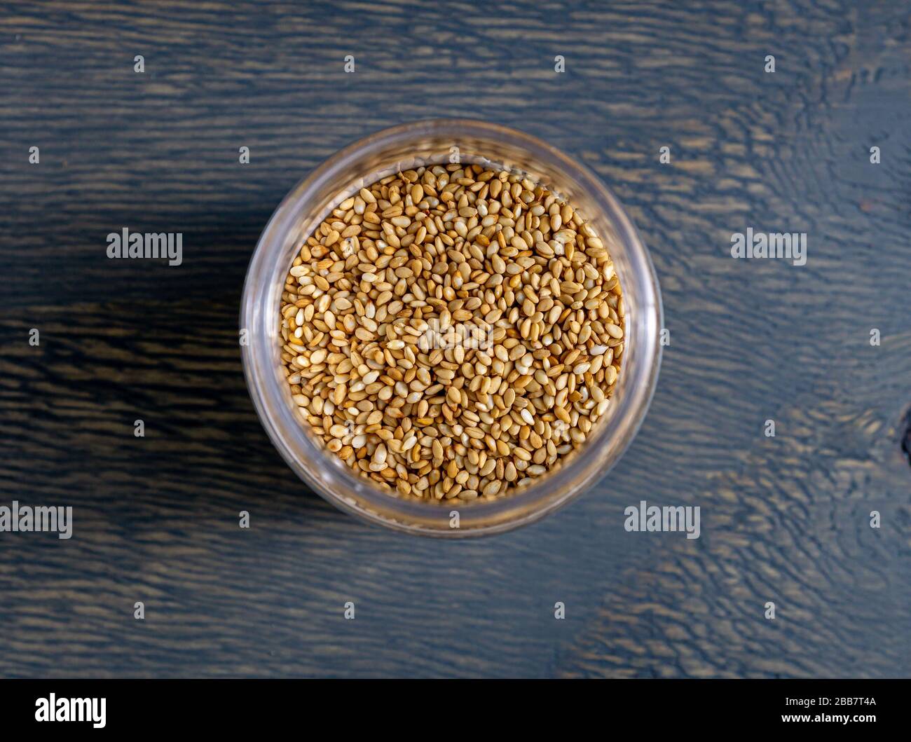Sesame seeds in glass jar Stock Photo Alamy