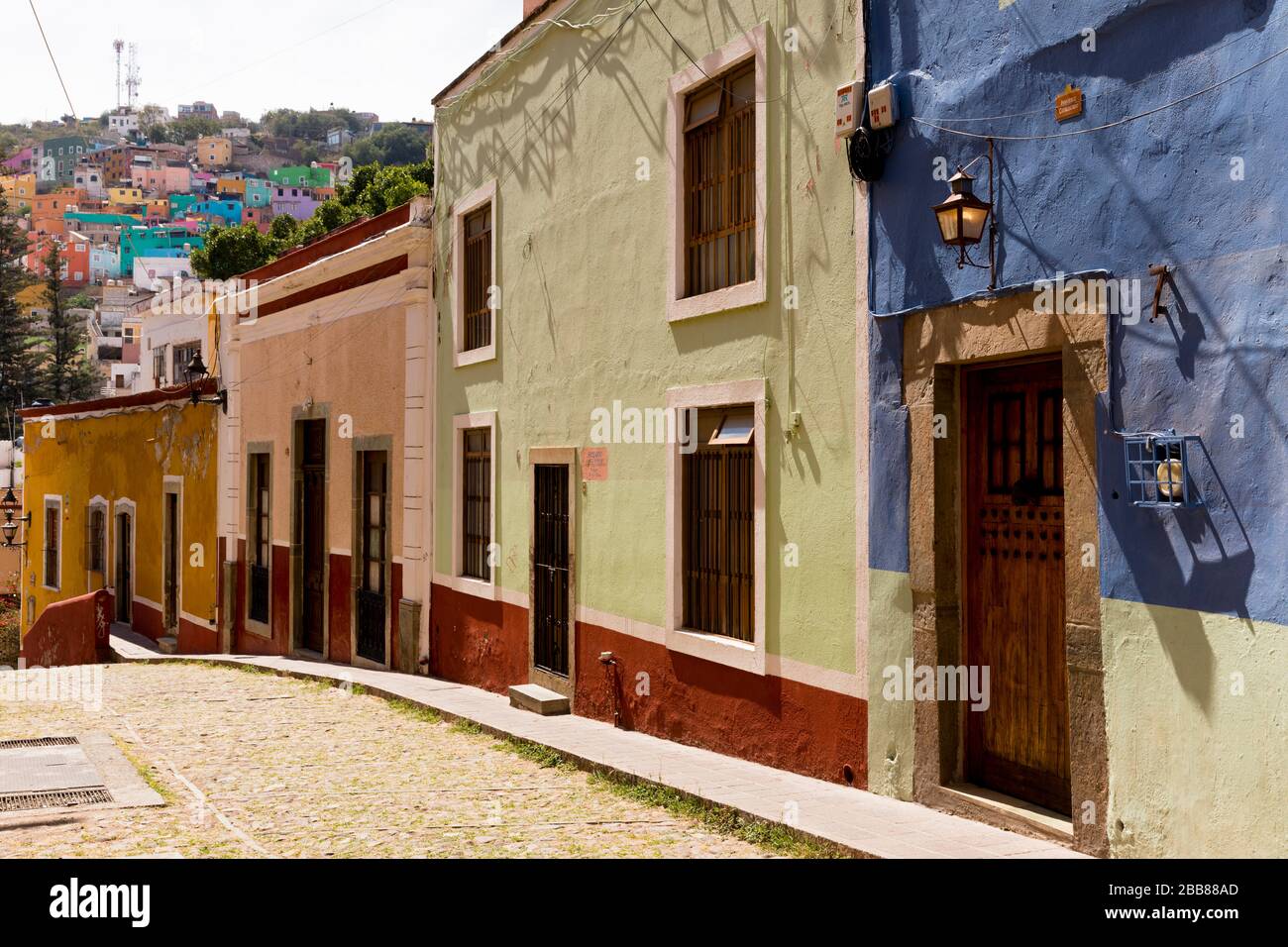 Mexico,  Guanajuato State, Guanajuato, Spanish Colonial era buildings lining a street Stock Photo