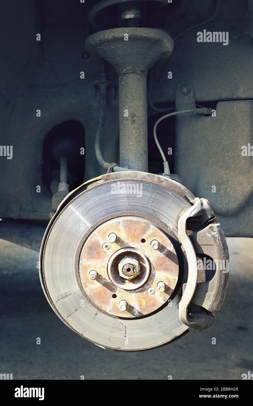 A car brake disc with stopping support without wheels closeup view vertical Stock Photo