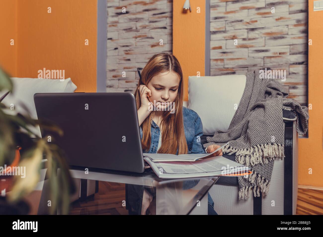 Girl Sitting On The Floor Studying On Line With A Laptop Before