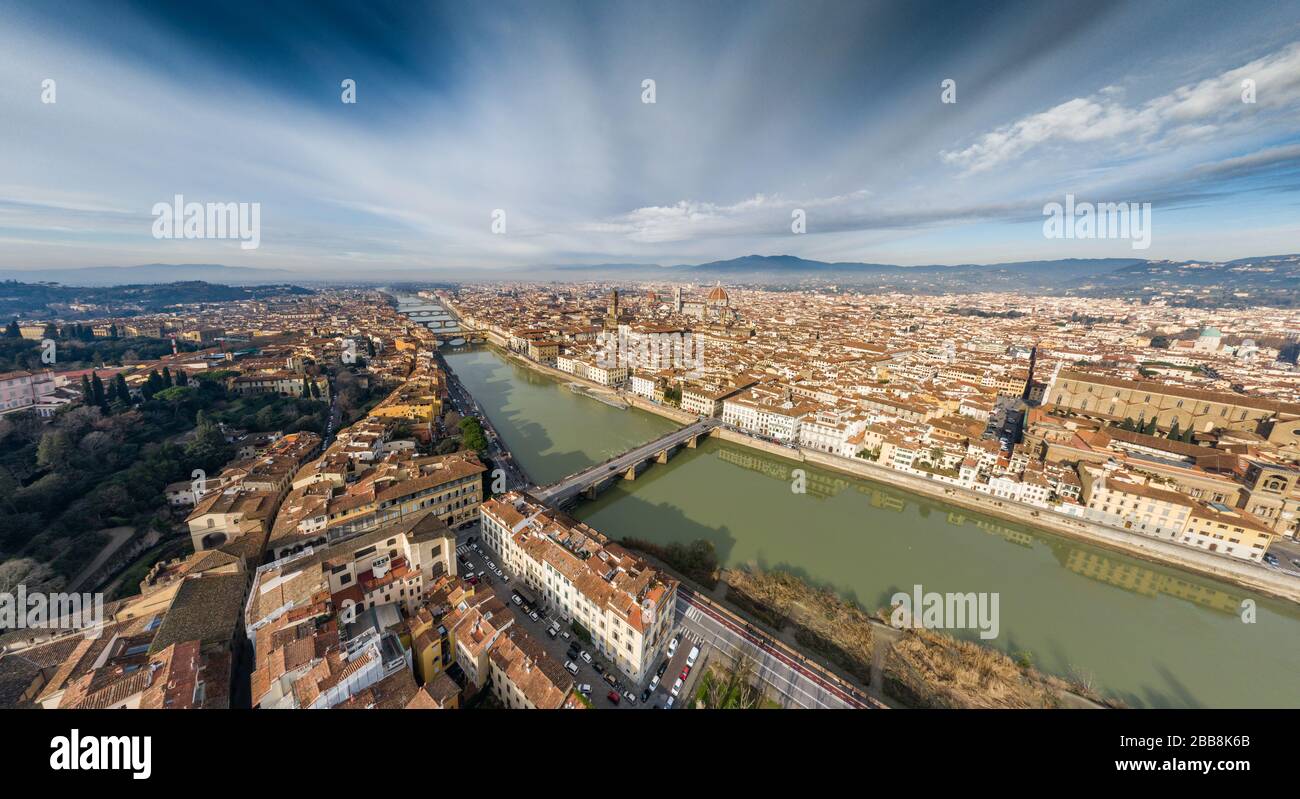 Aerial panorama of Florence at sunrise, Firenze, Tuscany, Italy, cathedral, river, drone pint view, mountains is on background Stock Photo