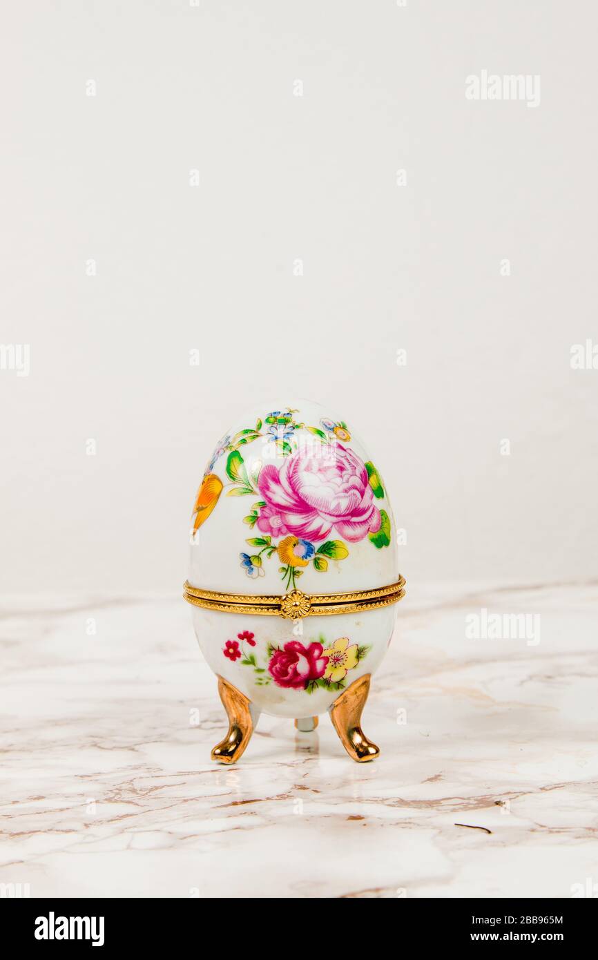 Luxury Easter egg with decorations on a marble background Stock Photo