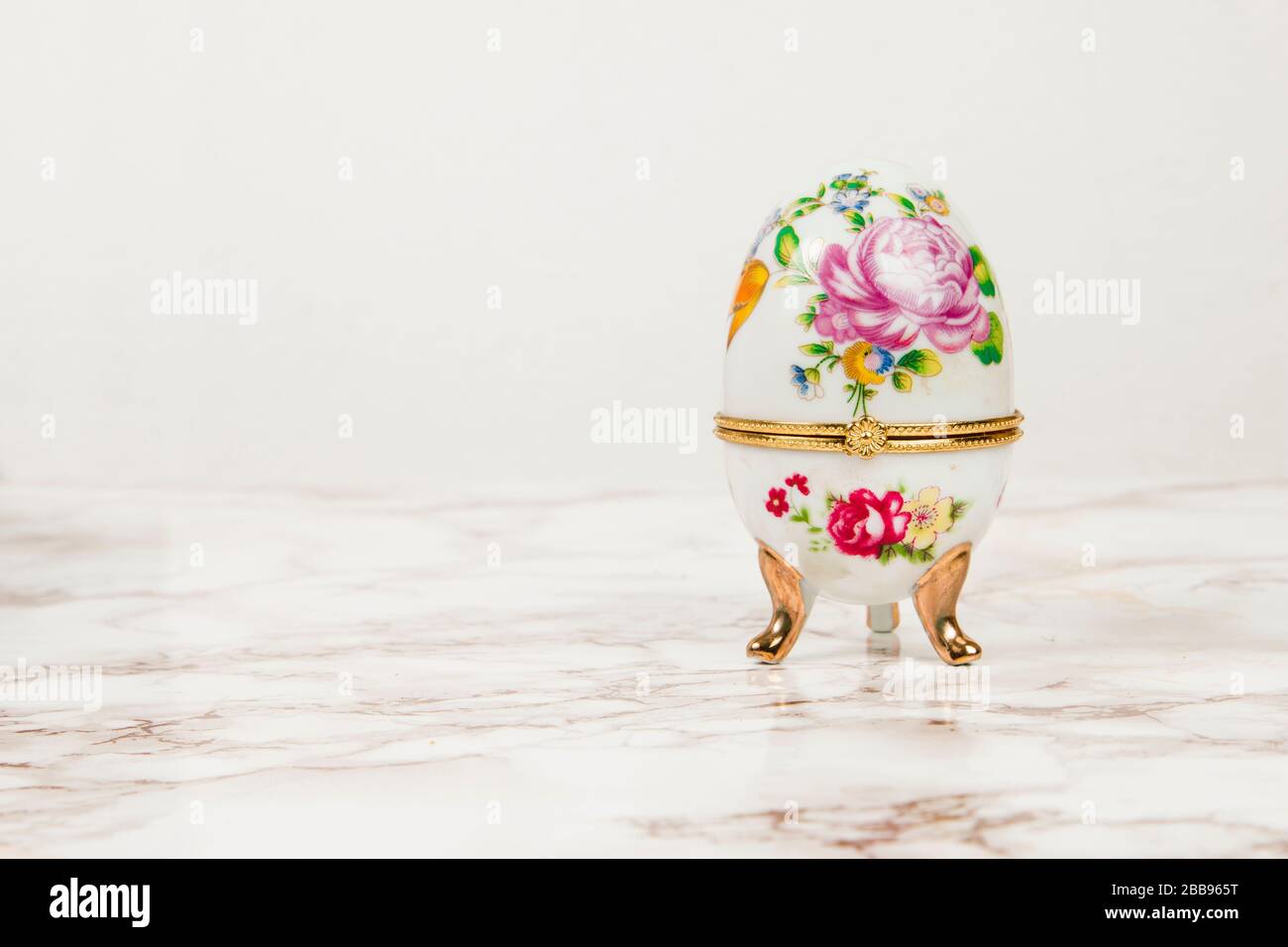 Luxury Easter egg with decorations on a marble background Stock Photo