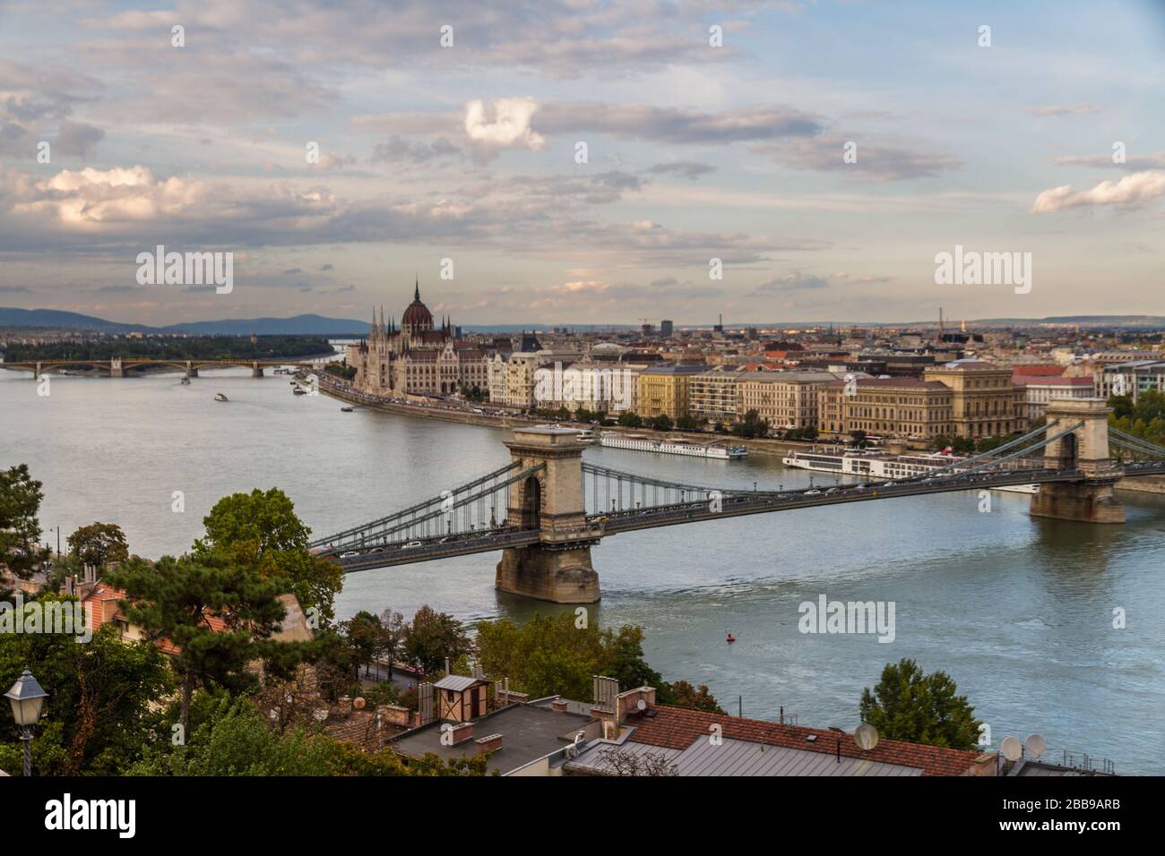 Evening view of river danube, chain bridge and Hungarian Parliament Building, Budapest, Hungary, landscape, clouds in sky. Stock Photo