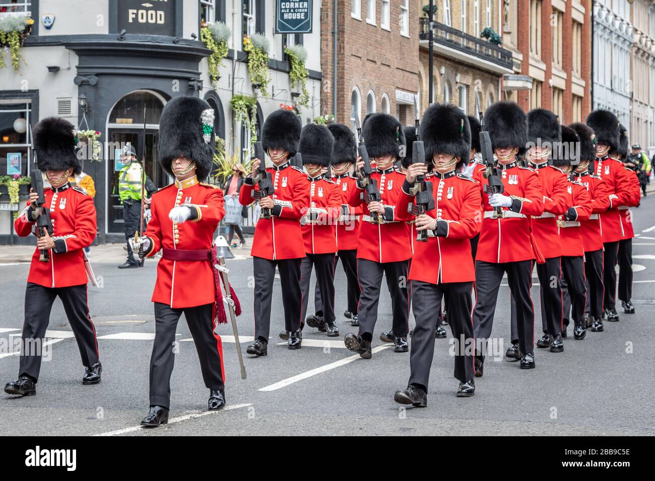 Soldiers of the Welsh Guards 'Change Arms' on the march back to Victoria barracks, Windsor, Berkshire, UK - May 28th 2019 Stock Photo