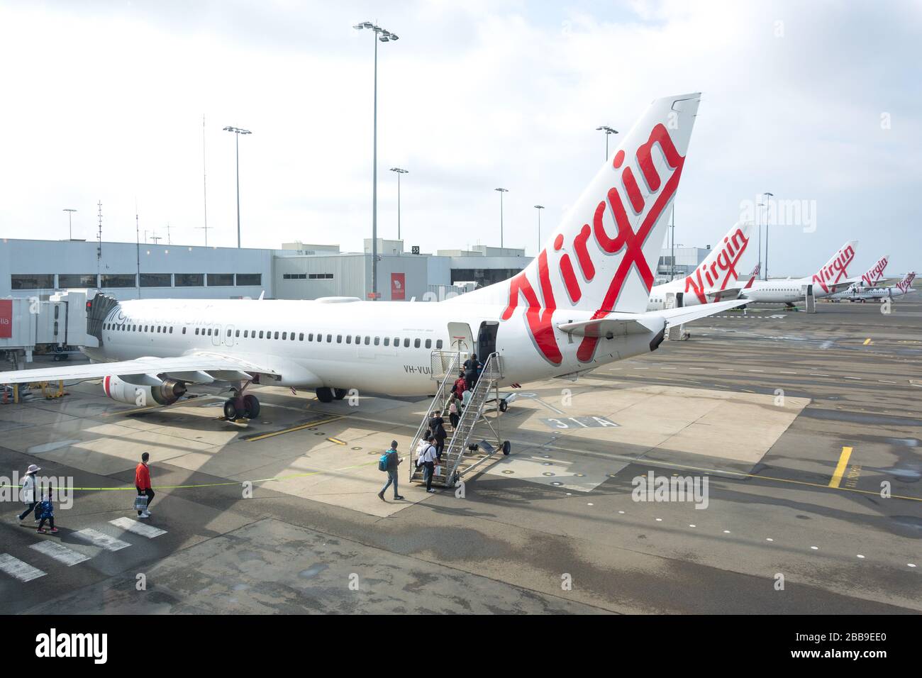 Passengers boarding Virgin Australian Boeing 737 at Sydney Kingsford Smith Airport, Mascot, Sydney, New South Wales, Australia Stock Photo