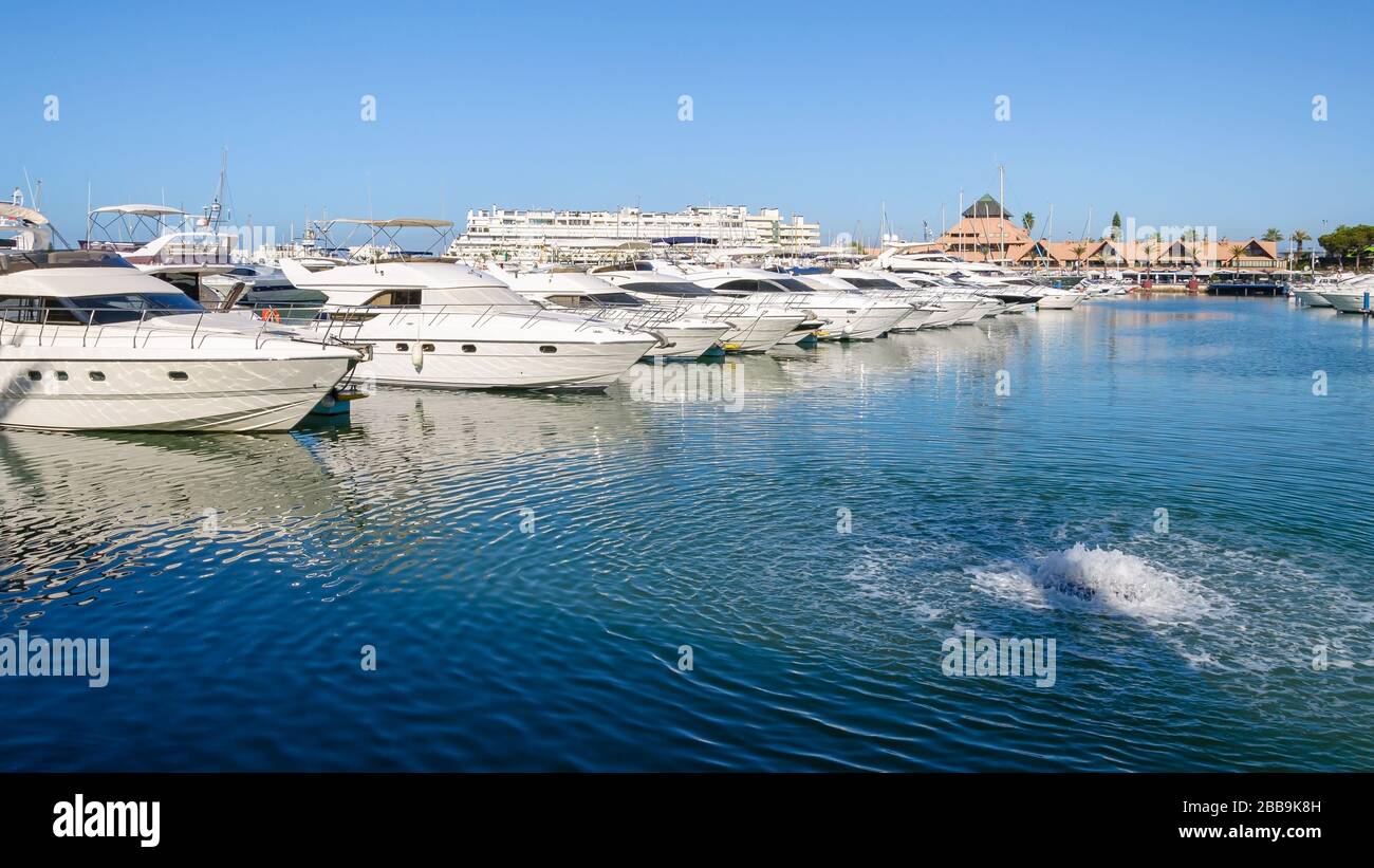 Luxury yachts moored in the port of Vilamoura, Algarve, Portugal Stock Photo