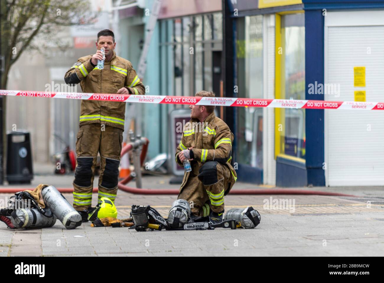 Fire Service dealing with a fire next to Sainsbury's supermarket in Westcliff on Sea, Essex, UK during COVID-19 lockdown. Firefighters recovering Stock Photo