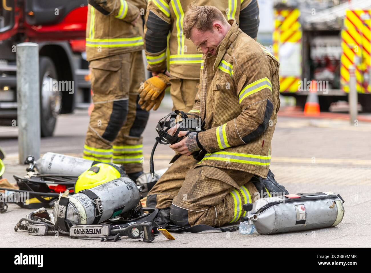 Fire Service dealing with a fire next to Sainsbury's supermarket in Westcliff on Sea, Essex, UK during COVID-19 lockdown. Cleaning equipment, tanks Stock Photo