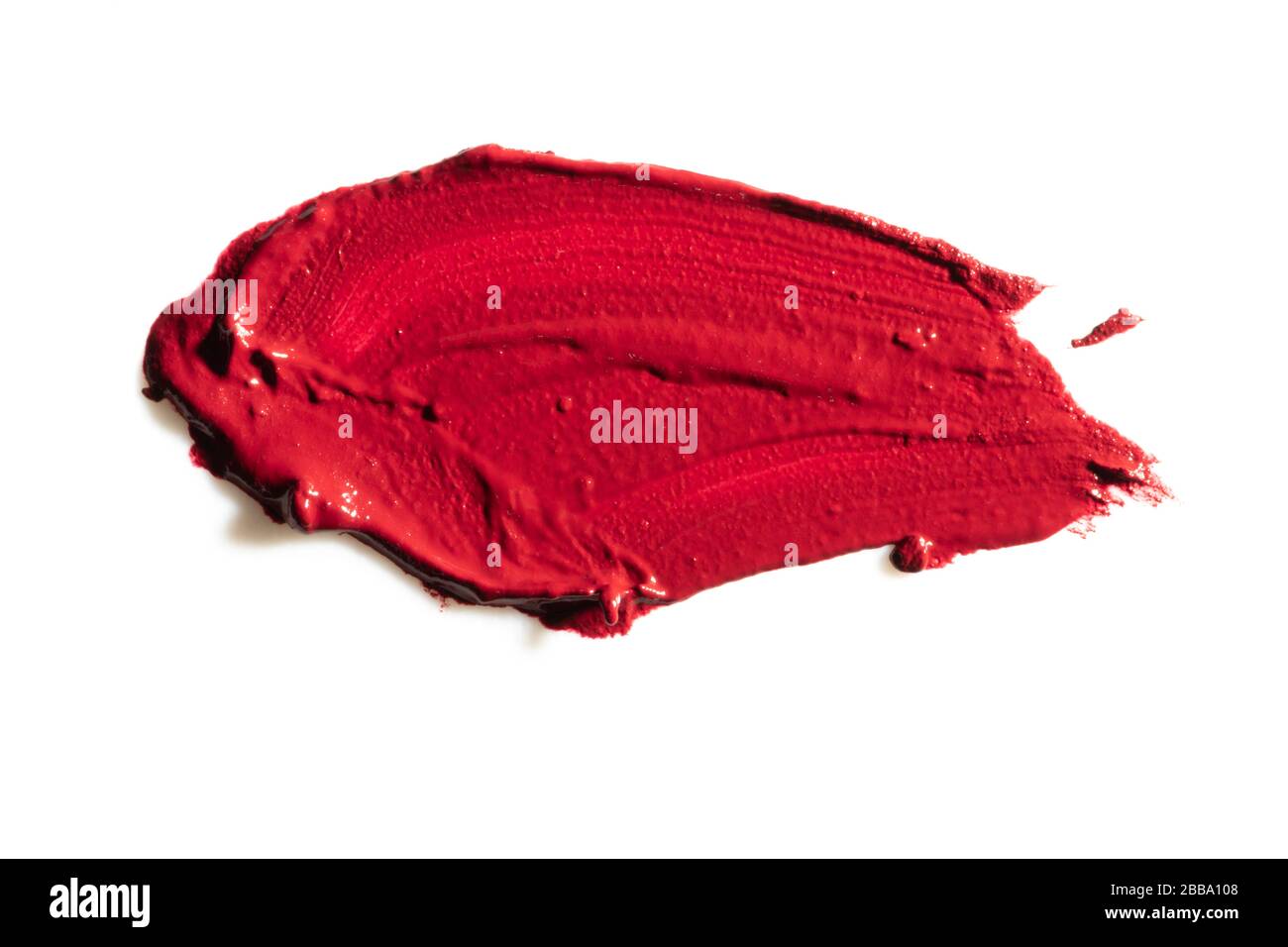 Red lipstick cosmetic product brush stroke swipe sample. Lipstick