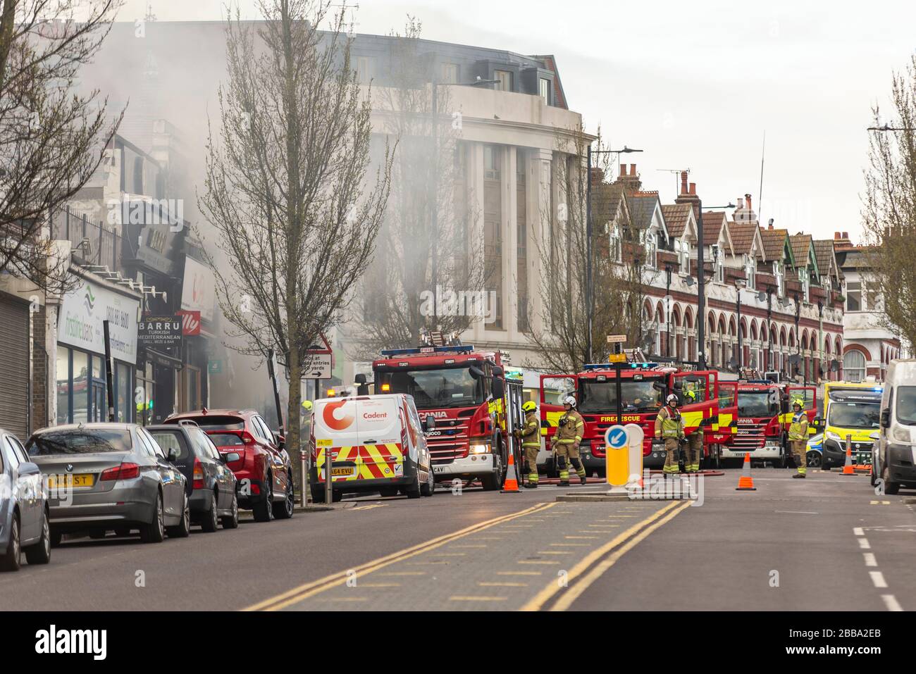 Fire Service dealing with a fire next to Sainsbury's supermarket in Westcliff on Sea, Essex, UK during COVID-19 lockdown. Fire engines and firefighter Stock Photo