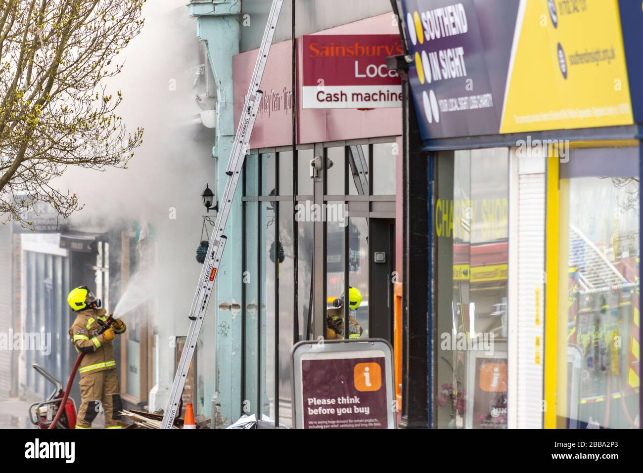 Fire Service dealing with a fire next to Sainsbury's supermarket in Westcliff on Sea, Essex, UK during COVID-19 lockdown. Cannabis plants discovered Stock Photo