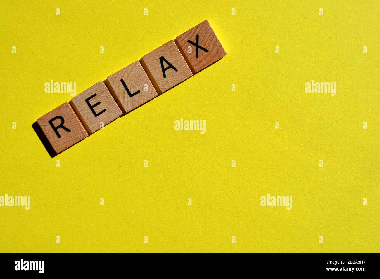 Relax, word on yellow background with copy space Stock Photo