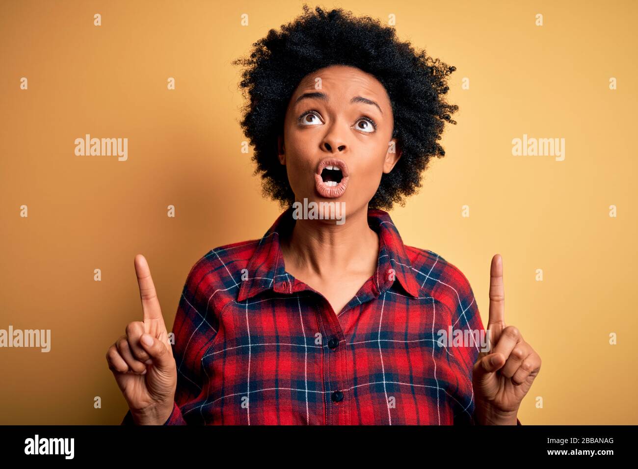 Young beautiful African American afro woman with curly hair wearing ...