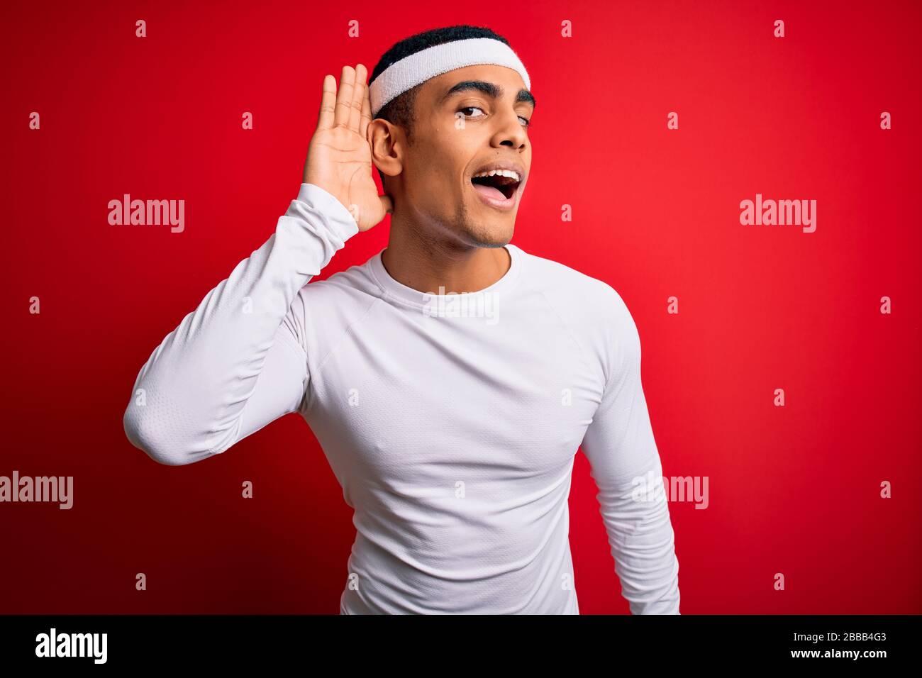 Young handsome african american sportsman wearing sportswear over red ...