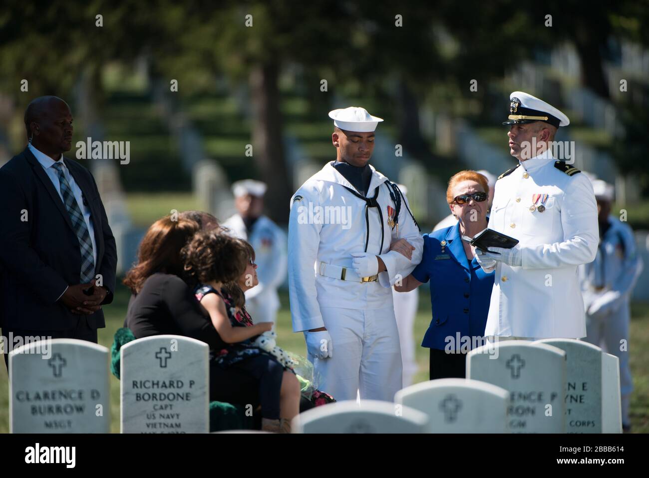 'U.S. Navy Chap. Lt. Chad Hoeppel, right, speaks during the graveside service for U.S. Navy Capt. Kent S. Webber in Section 60 of Arlington National Cemetery, Sept. 22, 2016, in Arlington, Va. (U.S. Army photo by Rachel Larue/Arlington National Cemetery/released); 22 September 2016, 13:54; Graveside service for U.S. Navy Capt. Kent S. Webber; Arlington National Cemetery; ' Stock Photo