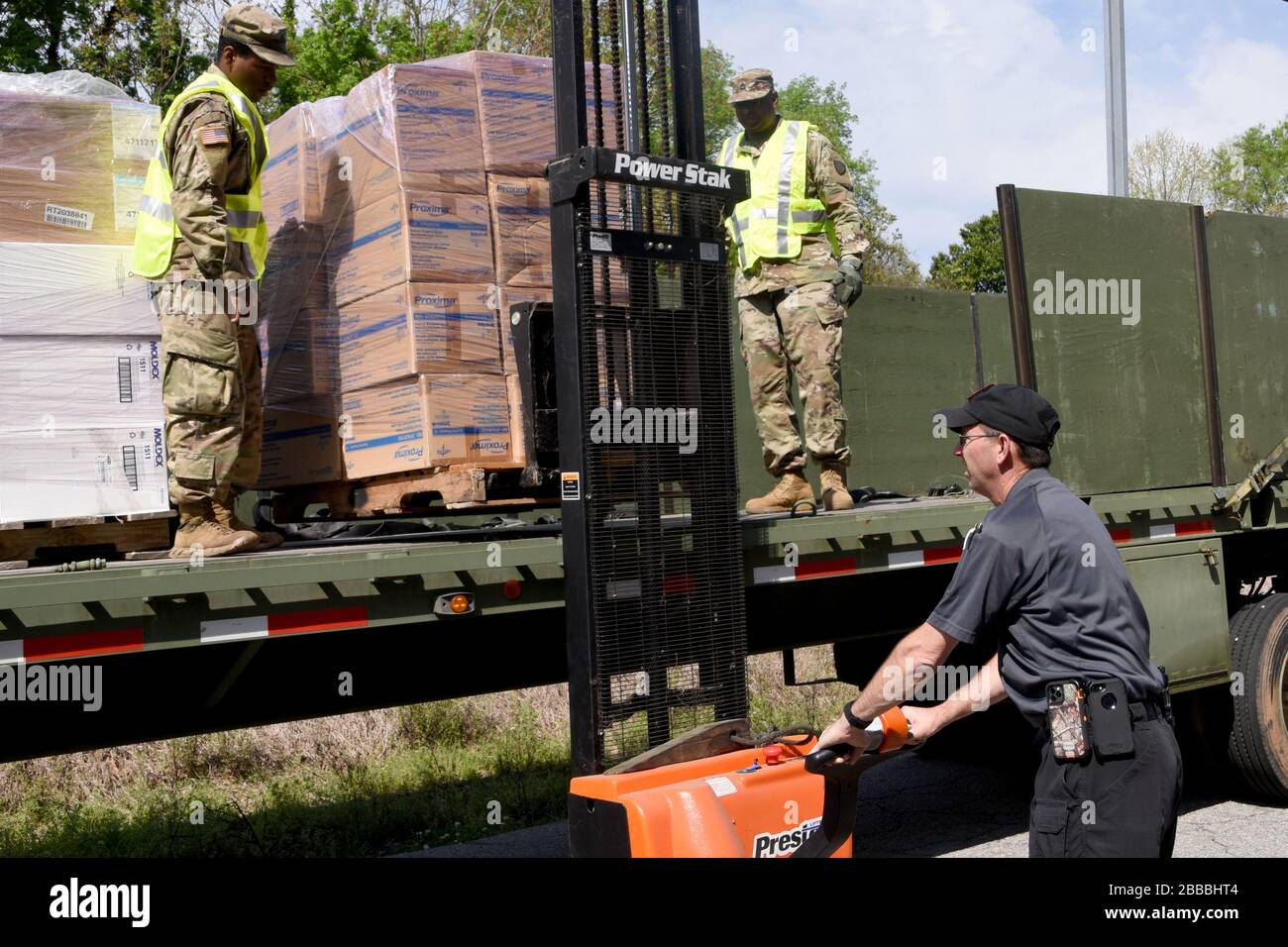 U.S. Army National Guard Soldiers with the 1053rd and 1055th Transportation companies, South Carolina National Guard, transport personal protective equipment and other supplies March 27, 2020 to the 46 counties in South Carolina in support of the South Carolina Department of Health and Environmental Control.  The South Carolina National Guard remains ready to support the counties, local and state agencies, and first responders with requested resources for as long as needed in support of COVID-19 response efforts in the state. (U.S. Army National Guard photo by Sgt. 1st Class Joe Cashion, South Stock Photo