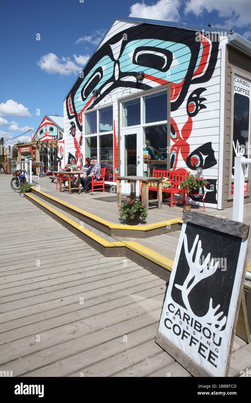 Carcross Commons is a grouping of tourism-related businesses and recreational activities where all the buildings are covered in Tagish and Tlingit First Nations art. Carcross, Yukon Territory, Canada Stock Photo