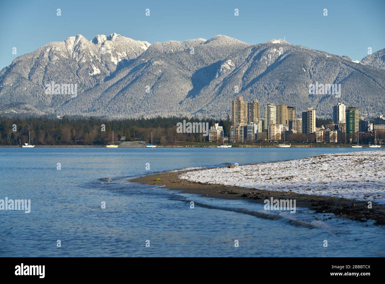 English Bay Winter Cityscape. The Coast Mountains behind English Bay and condominium towers, Vancouver. Stock Photo