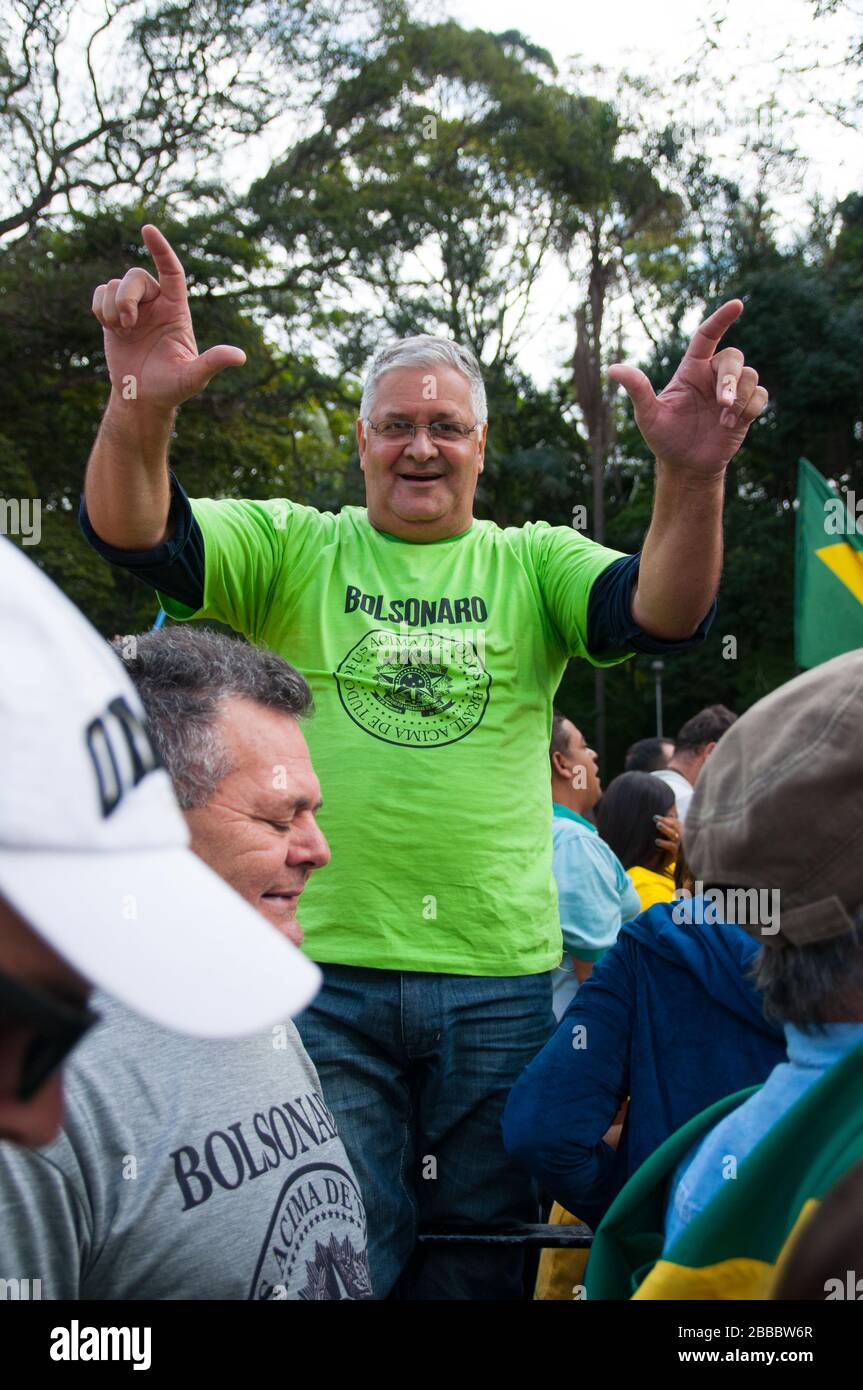 Sao Paulo, SP, Brazil, 2018/10/21, Demonstration pro presidential candidate Jair Bolsonaro on Paulista Avenue - man does the candidate's trademark ges Stock Photo