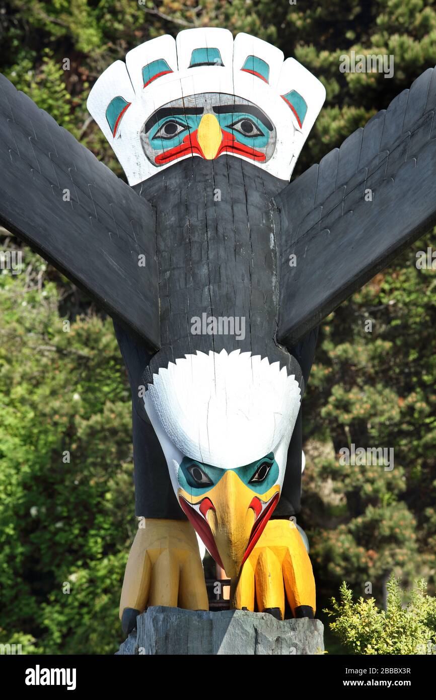 Detail of a wood sculpture entitled 'Thundering Wings' by Chilkoot Tlingit carver Nathan Jackson located next to cruise ship dock 3 in Ketchikan, Alaska, U.S.A. Stock Photo