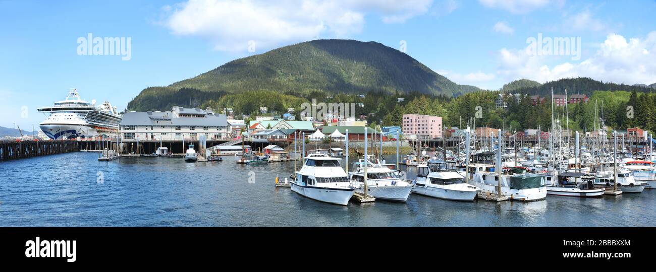 Thomas Basin which provides moorage for various water crafts and fishing boats in Ketchikan, Alaska, U.S.A. On the left is the berthing area for cruise ships. Stock Photo