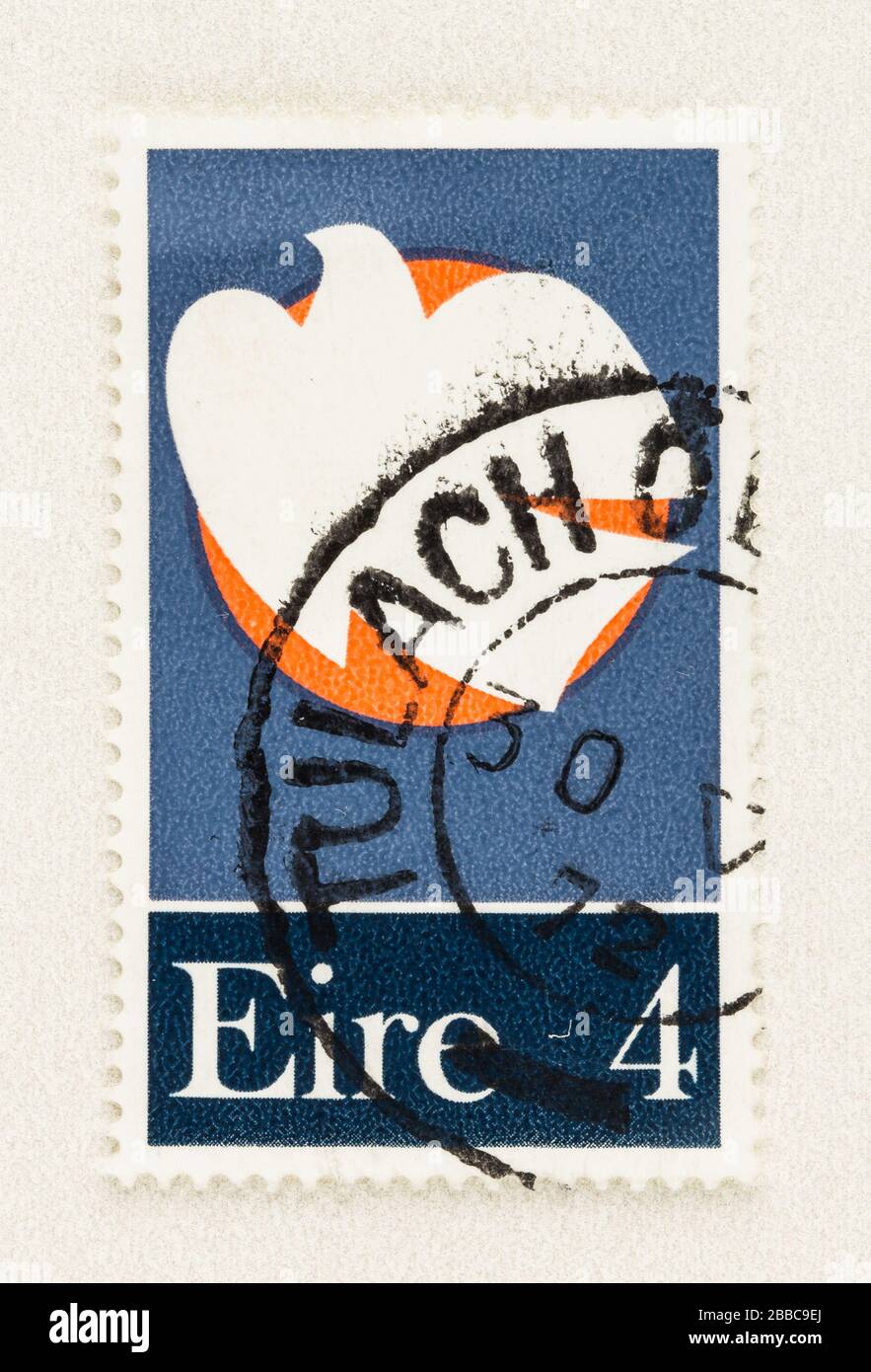 SEATTLE WASHINGTON - March 29, 2020: Close up of Ireland postage stamp featuring dove soaring past the rising moon, issued in 1972. Stock Photo