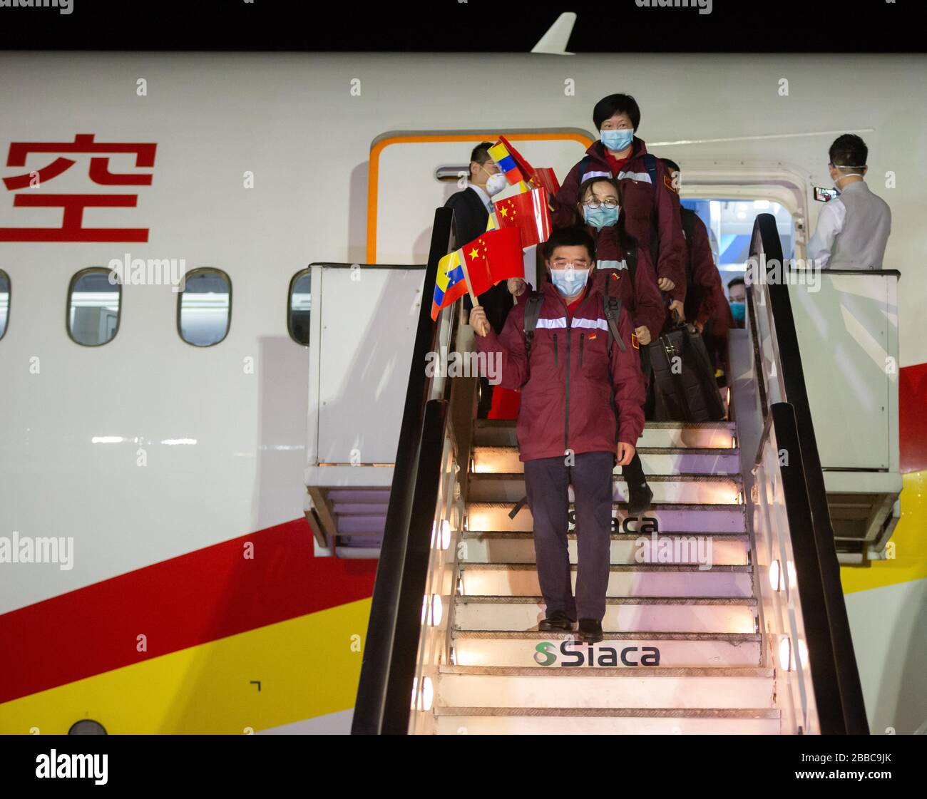 Beijing, Venezuela. 30th Mar, 2020. Chinese medical experts arrive at the Simon Bolivar International Airport, in La Guaira, Venezuela, on March 30, 2020. Credit: Marcos Salgado/Xinhua/Alamy Live News Stock Photo