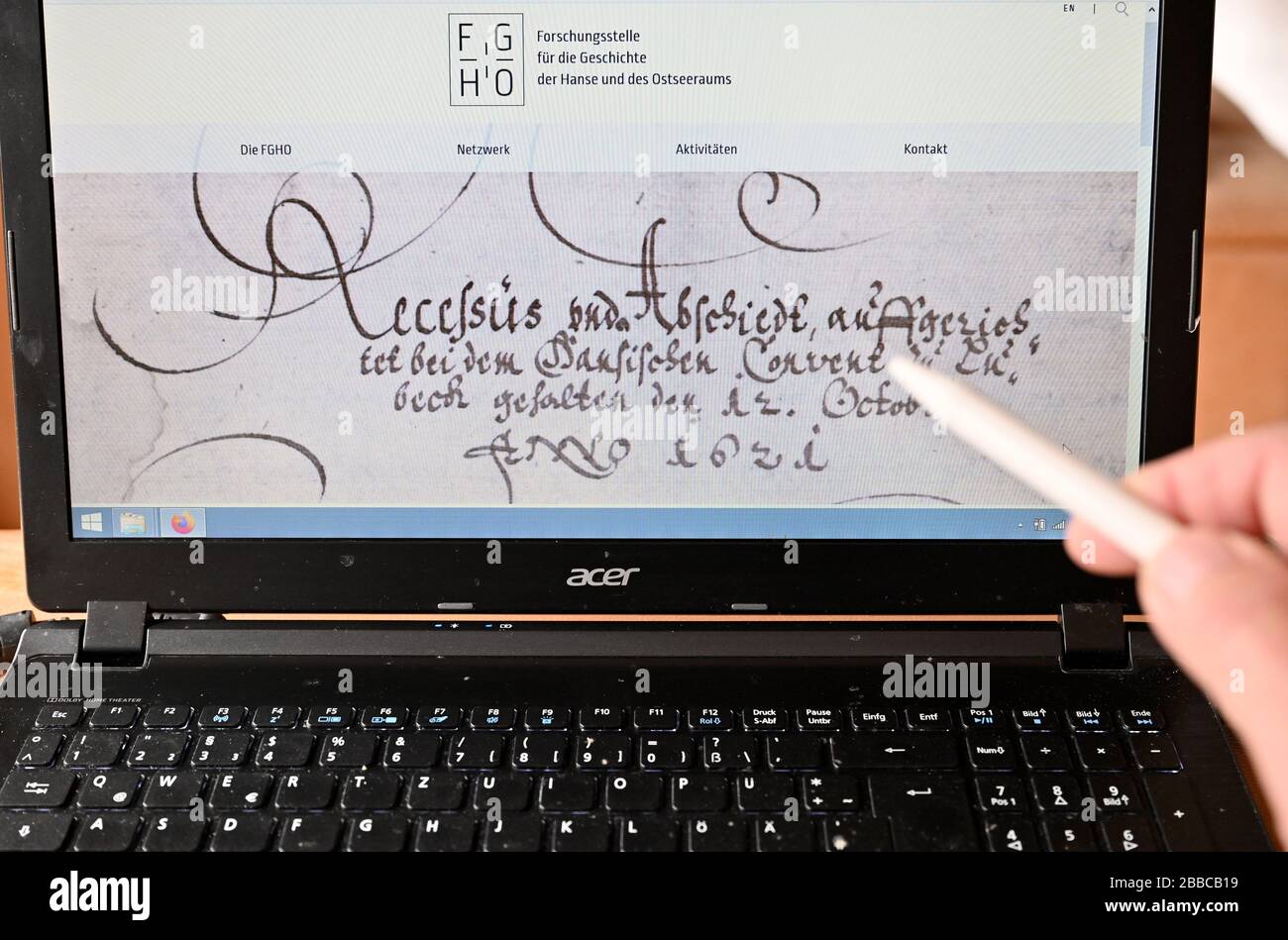 ILLUSTRATION - 30 March 2020, Schleswig-Holstein, Lübeck: A historical document from the time of the Hanseatic League can be seen on the screen of a computer. Reading and evaluating historical documents about the Hanseatic League is a dream for many a hobby historian. Thanks to a crowd project of the 'Forschungsstelle für die Geschichte der Hanse und des Ostseeraumes' (FGHO ) this dream can now come true. From now on, original documents from the late period of the Hanseatic League can be virtually read and decoded from the home computer via the 'Transkribus' platform. The FGHO announced that t Stock Photo