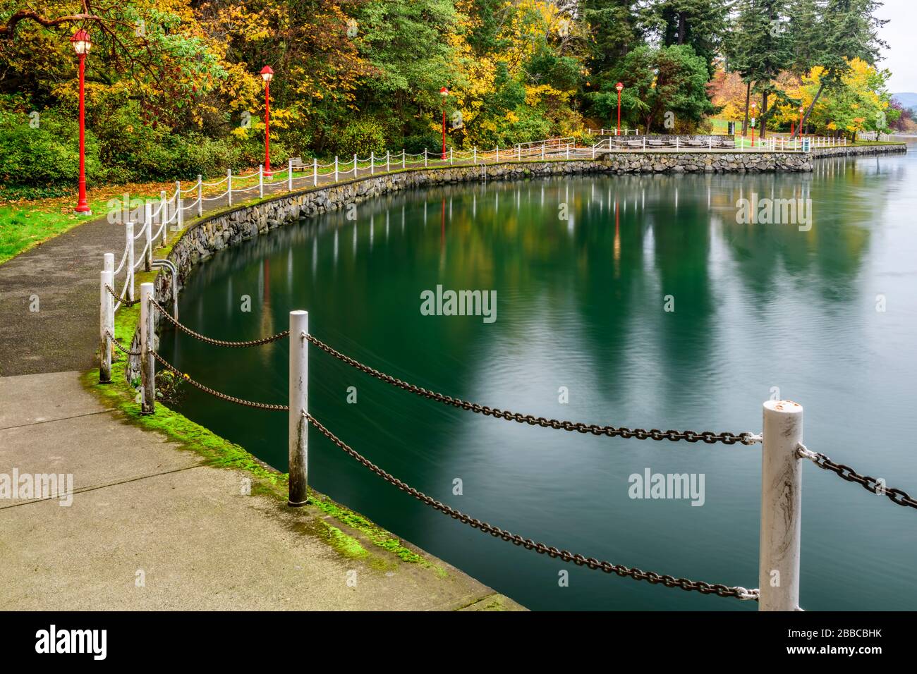 The walkway along the Gorge waterfront beside Esquimalt Gorge Park in Victoria, British Columbia. Stock Photo