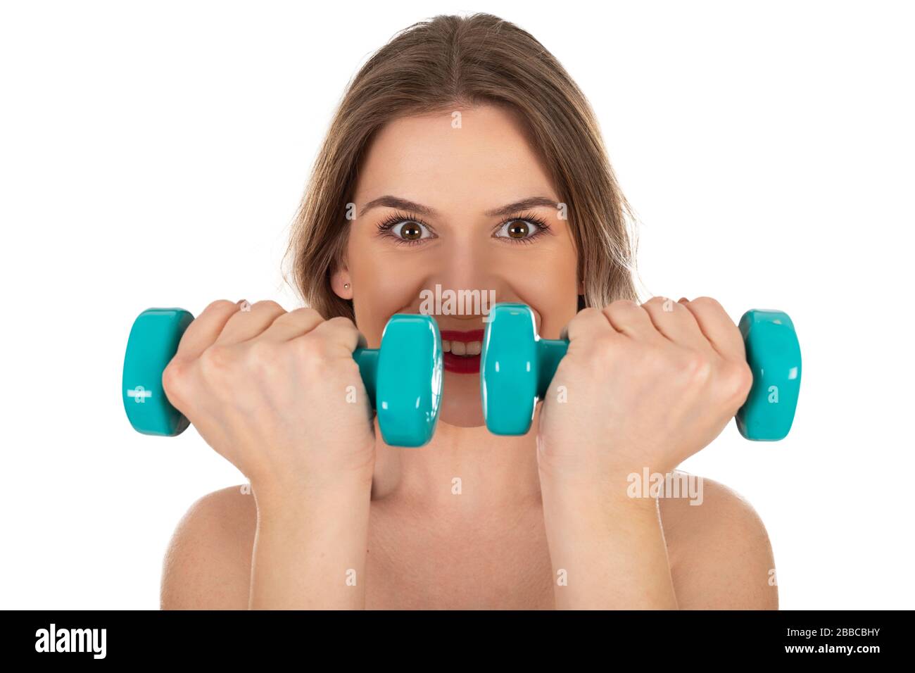 Beautiful active woman holding dumbbells on isolated background - self isolation, home workout concept Stock Photo