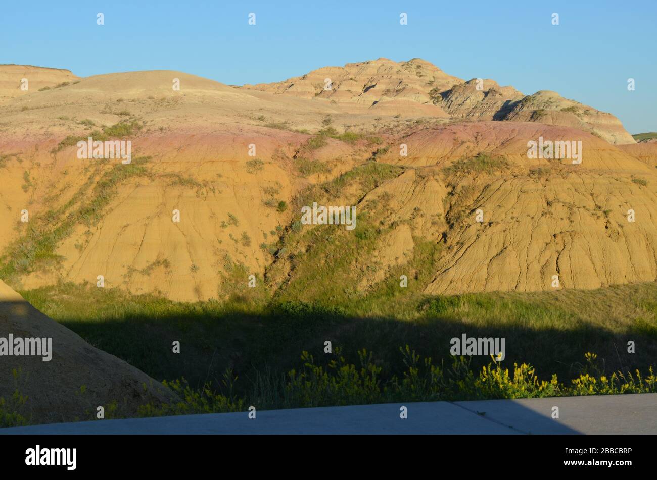 Late Spring in South Dakota: Dusk and Shadows at Yellow Mounds Overlook Along Loop Road in Badlands National Park Stock Photo