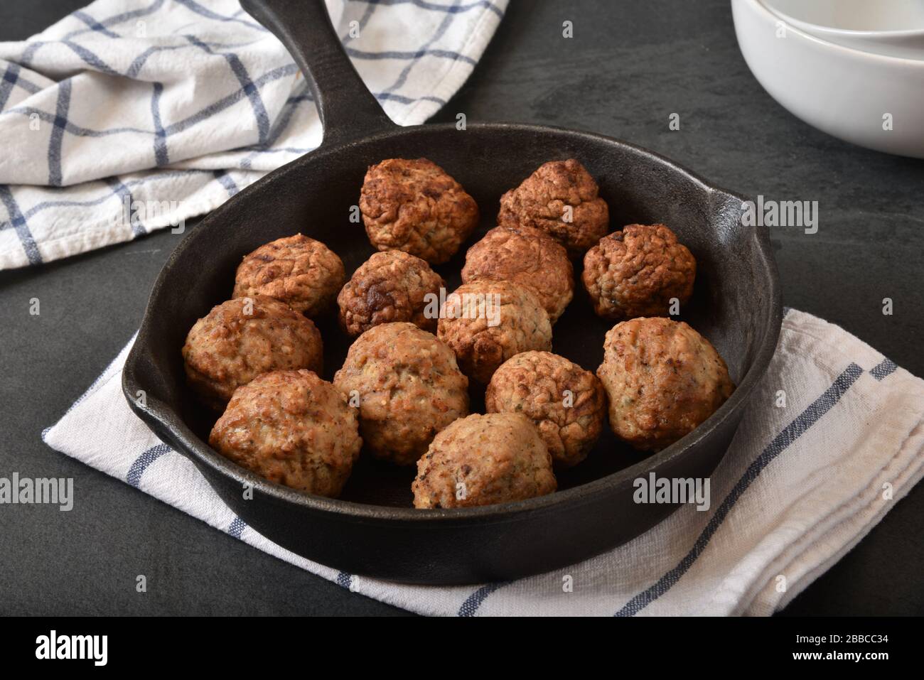Italian meatballs in a cast iron skillet Stock Photo Alamy