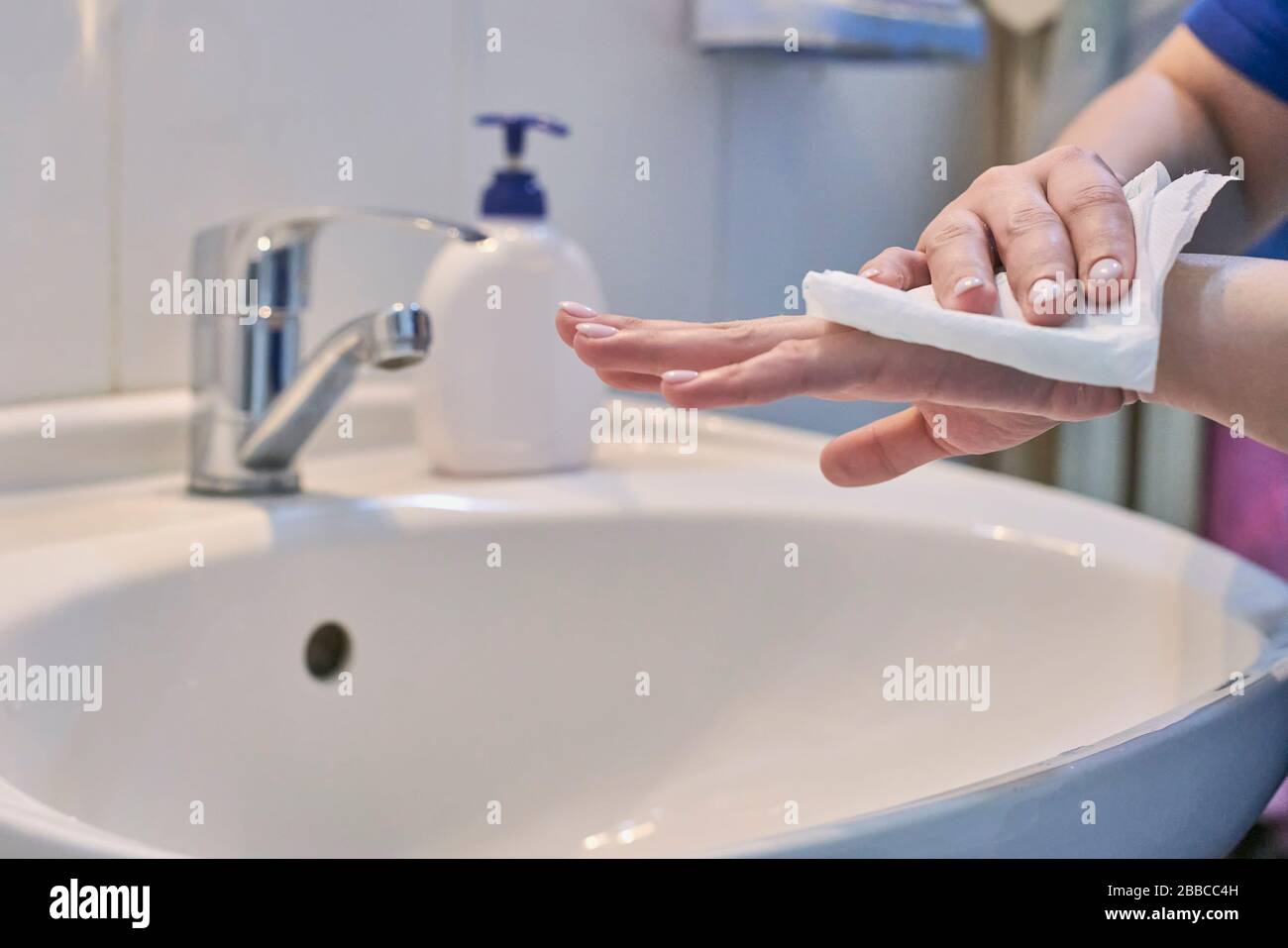 Unrecognizable female shows how to wash hands properly. Woman washs