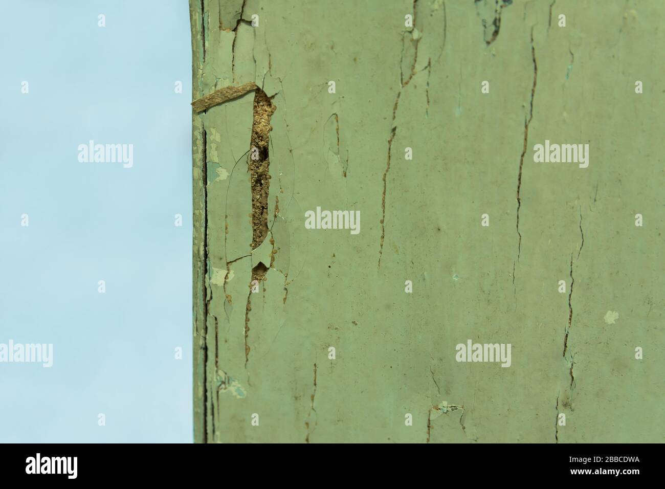 Close-up view of the termites damage on house wooden column Stock Photo