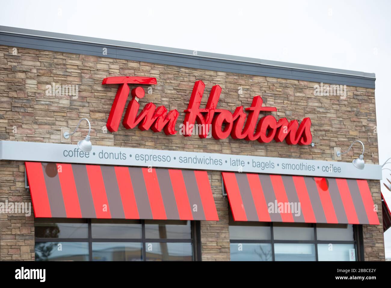 A sign showing Tim Hortons fast food restaurant drive thru. Tim Hortons is Canada's largest restaurant chain. Stock Photo