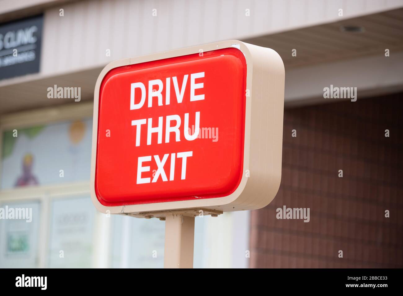 Close up of a sign showing Tim Hortons fast food restaurant drive thru Stock Photo
