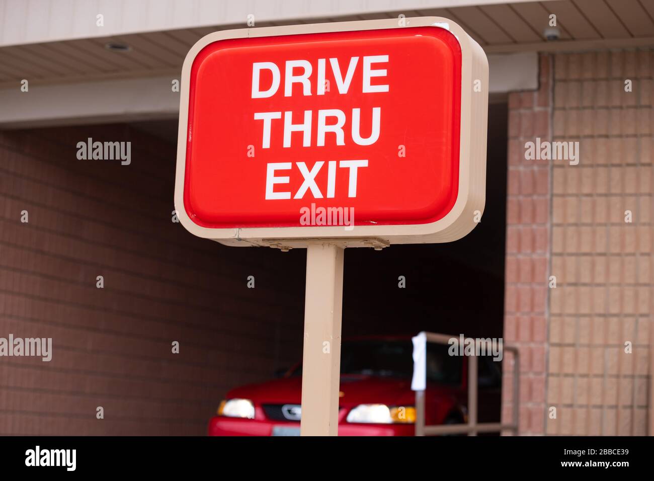 Close up of a sign showing Tim Hortons fast food restaurant drive thru. Tim Hortons is Canada's largest restaurant chain. Stock Photo