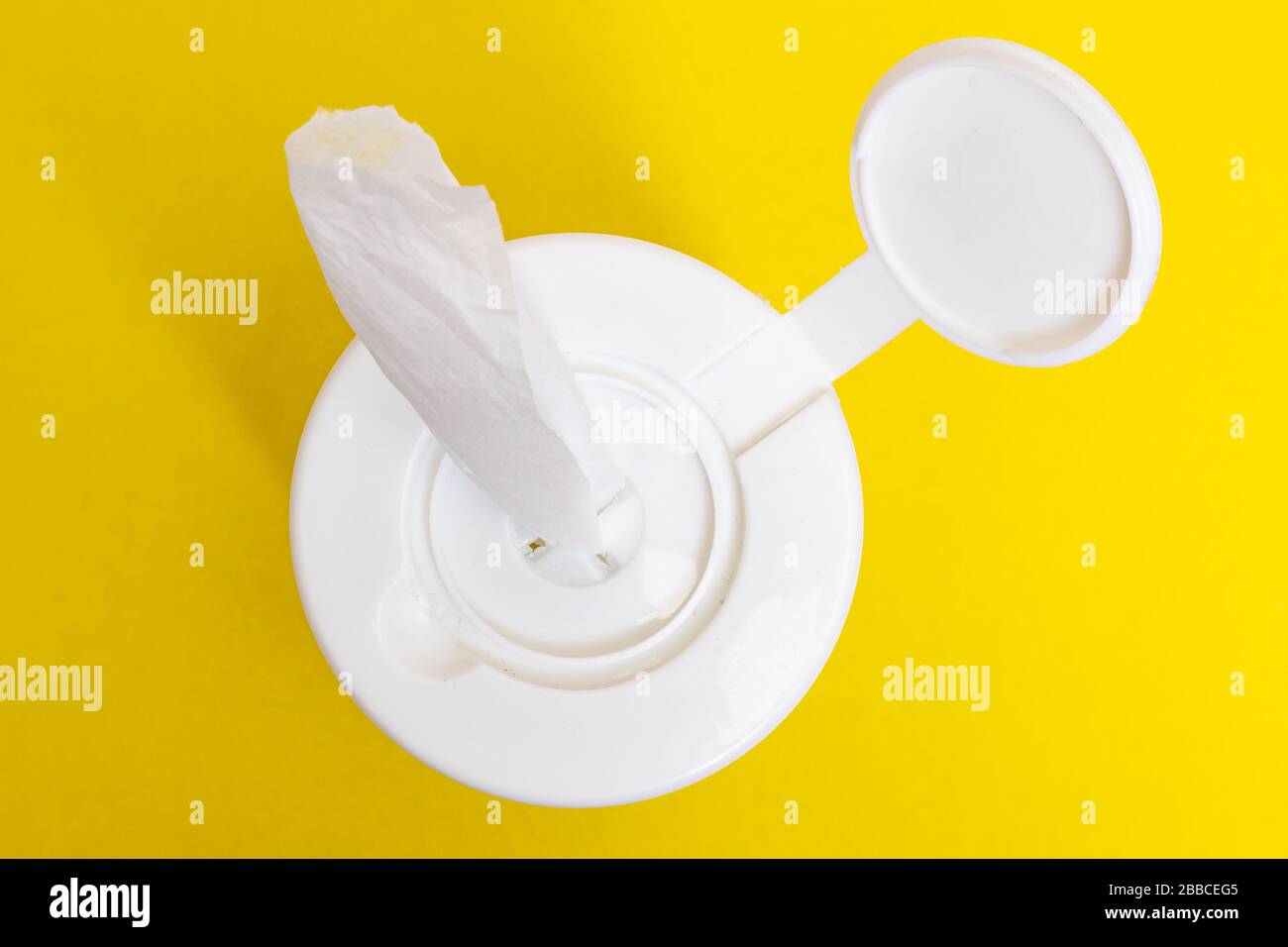 Disinfectant wipes in packaging on yellow background closeup Stock Photo