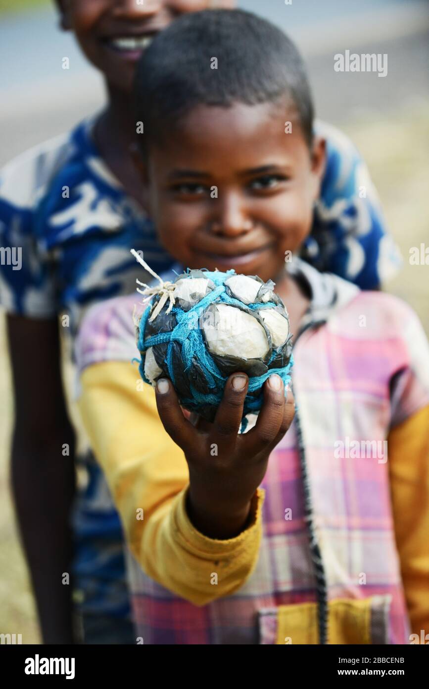 Young Ethiopian boys holding an improvised soccer ball. Stock Photo