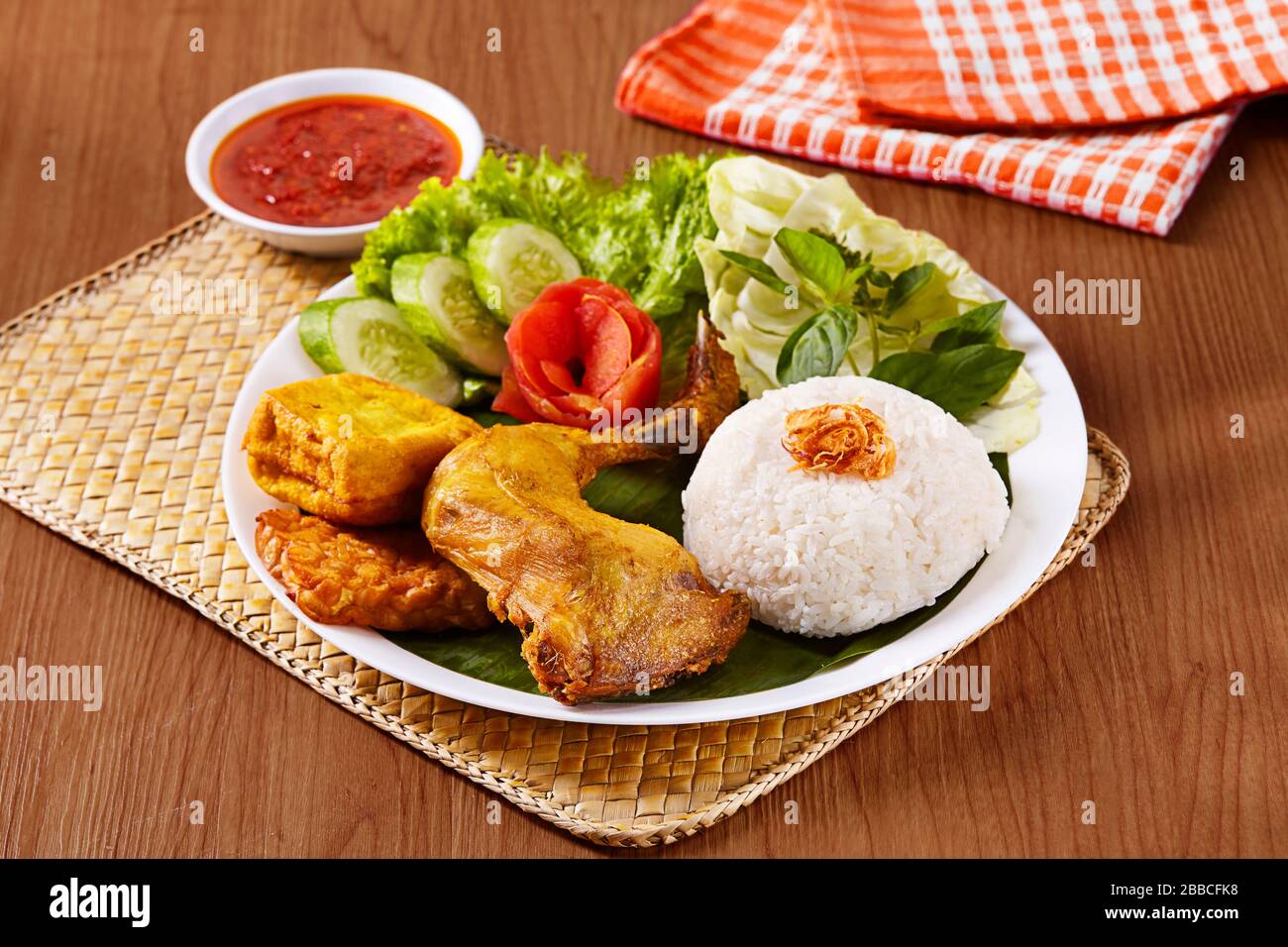 Indonesian chicken rice package consisting of rice, fried chicken