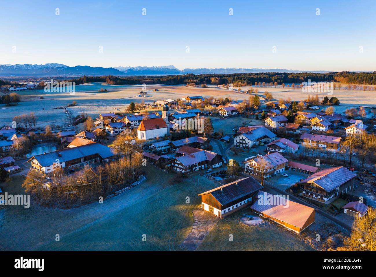 Village Lochen with church St. Magdalena in the morning light, near Dietramszell, Alpine chain, drone recording, foothills of the Alps, Upper Stock Photo