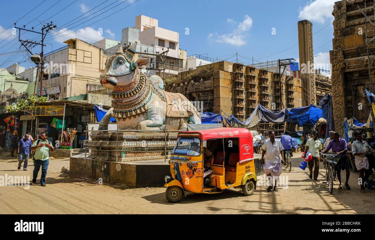 Madurai, India - March 2020: People walking around the blue Nandi in front of the entrance of the Pudhu Mandapa on March 10, 2020 in Madurai, India. Stock Photo