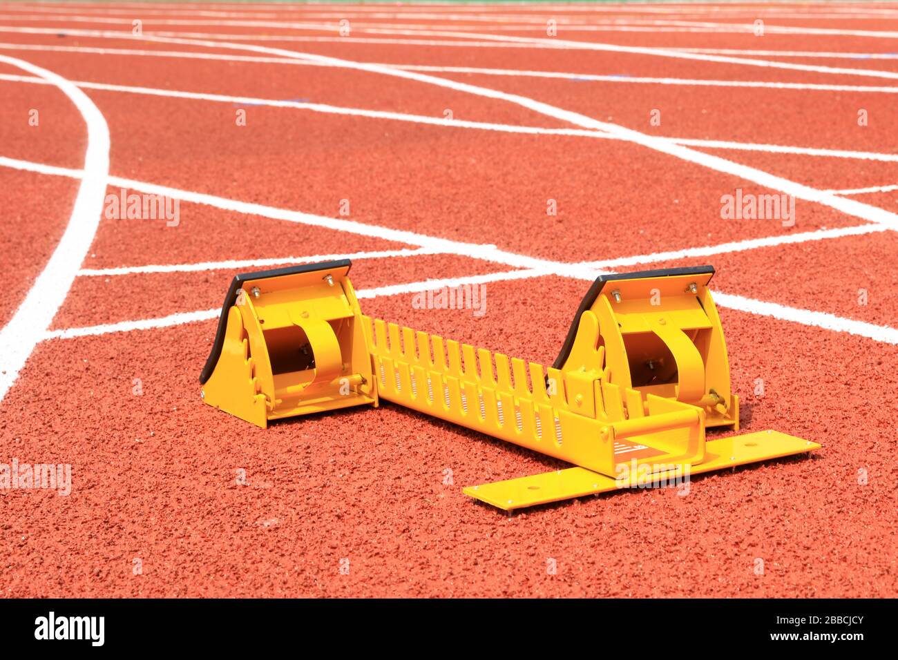 Starting blocks on the playground of the runway Stock Photo Alamy