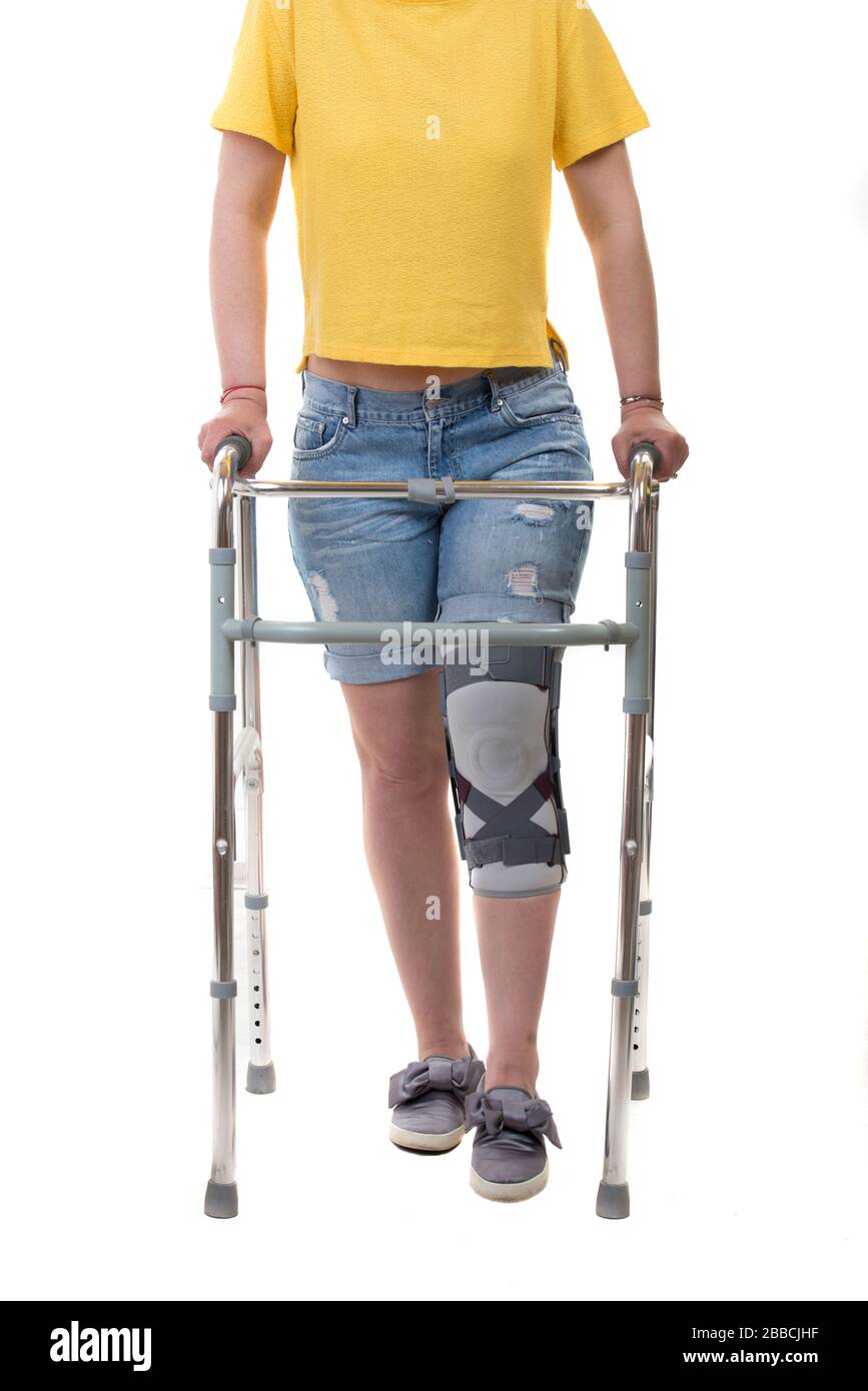 Woman After Car Accident In An Orthosis Sitting On Couch. Female Fastening  Knee Orthosis Or Knee Support Brace After Surgery On Leg Stock Photo,  Picture and Royalty Free Image. Image 194338779.