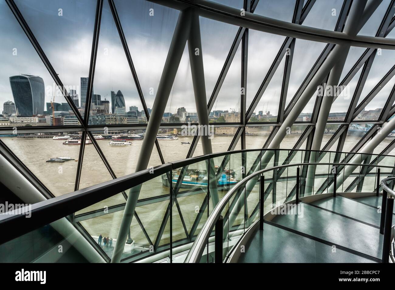 View of the River Thames from the interior staircase at City Hall, Southwark, which is the headquarters of the Greater London Authority, London Stock Photo