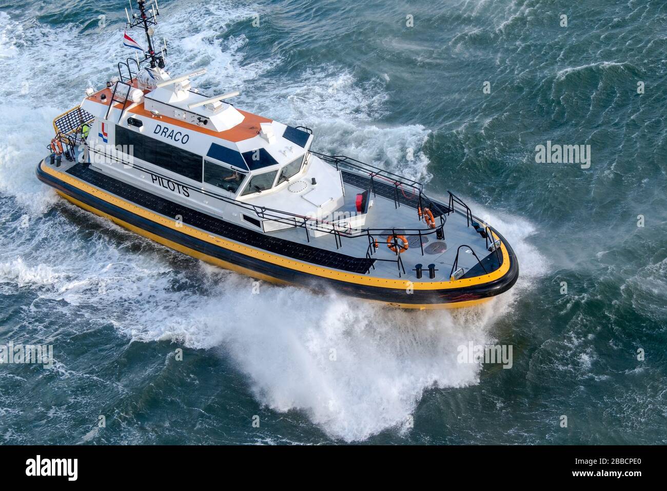 Dutch pilot boat DRACO viewed from a cruise ship leaving IJmuiden, North Holland, Netherlands Stock Photo